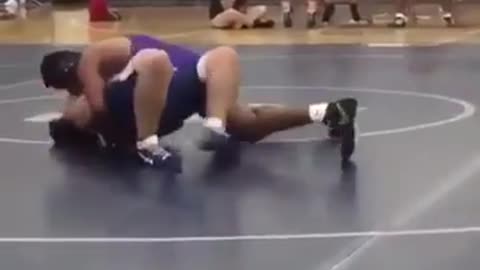Wrestling ref slides across floor