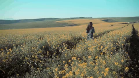 Beautiful View Of A Beautiful Girl Running In The Field Of Flowers