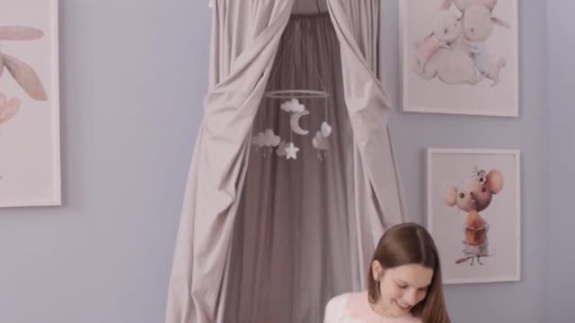 A pregnant woman playing with her dog new dachshund video