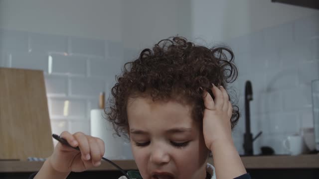 A Kid Eating Cereals