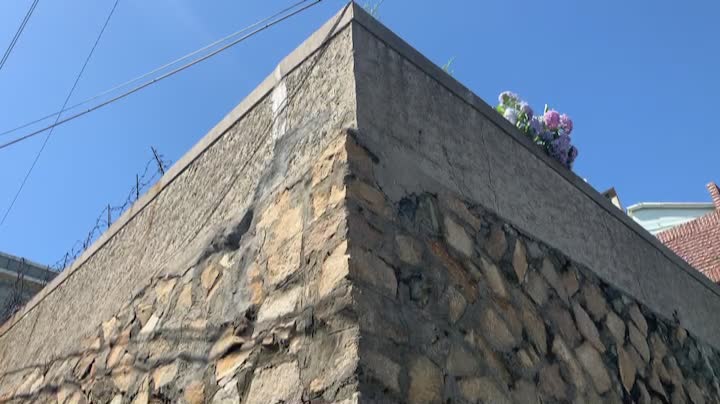 an edge of a building, a little windy