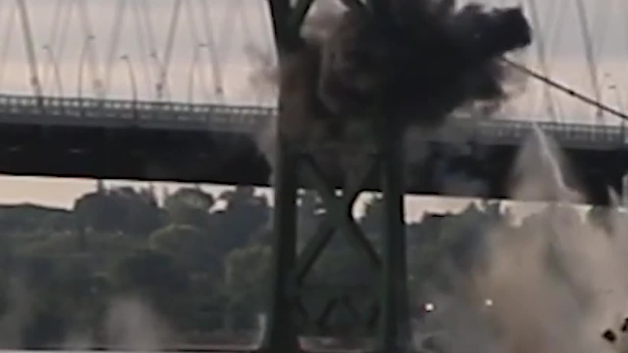 Controlled explosion sends pieces of a bridge tumbling into the water #Shorts