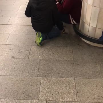 Woman red sweater black white rat on back