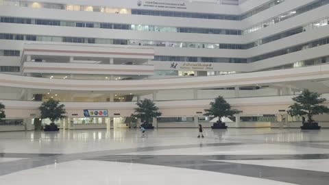 Two little girls make the government office as their skating area