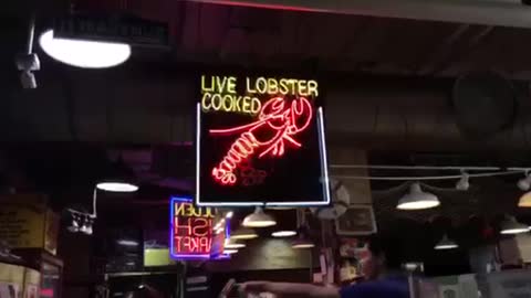 Moving lobster sign_The night market view of NewYork