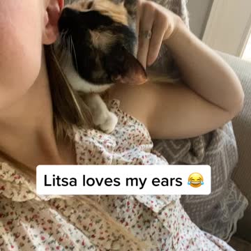 Kitty cleans owners ears!