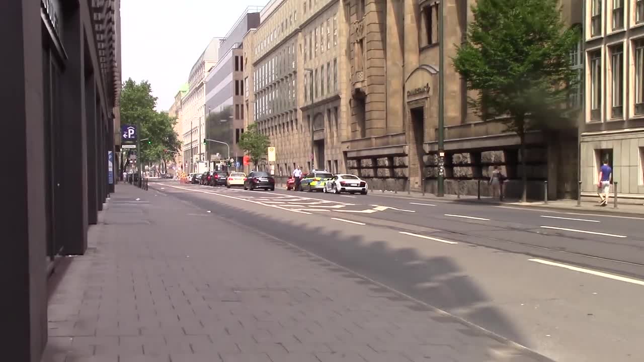 Exotic cars burnout through busy city streets, receive instant karma