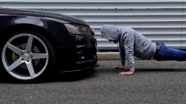 A race between a car and a mechanic