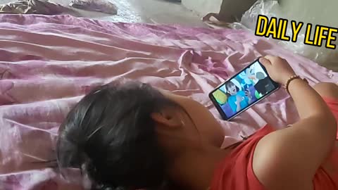 Baby watching movies playing on the phone is so cute