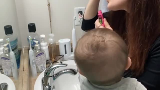 doing makeup in front of a baby be like...