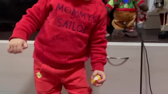 Adorable kid love to dance with his toys