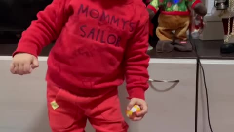 Adorable kid love to dance with his toys