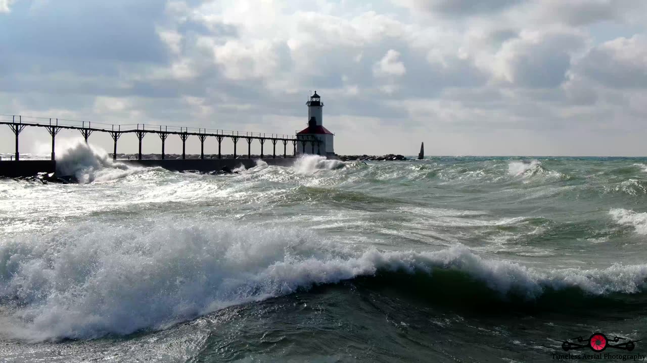 Relaxing Massive Waves Slam Into Michigan City Lighthouse 4K Drone Footage