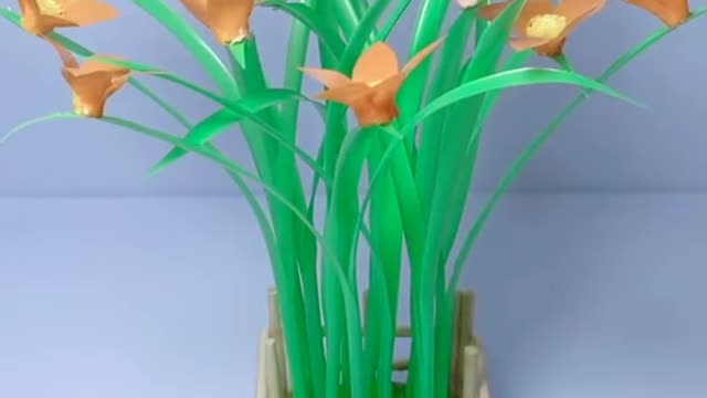 Fence made of disposable chopsticks, straw transformed into potted flowers