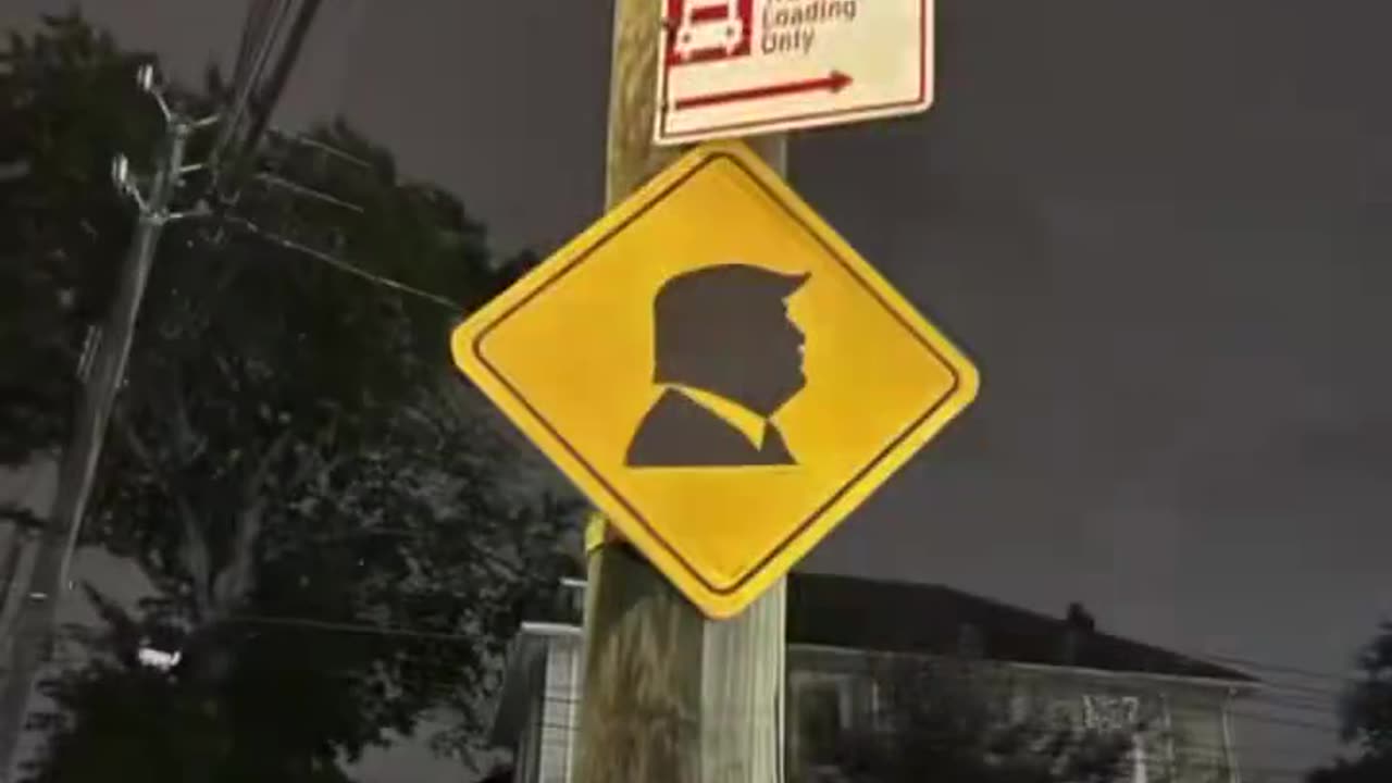 Trump silhouette street signs on all all utility poles