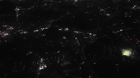 On the plane. Night flight. City from the sky.