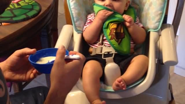 Baby Knocks Cereal Out Of Dad's Hands