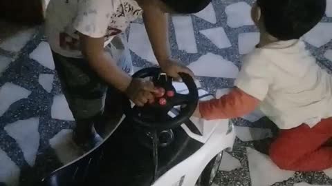 child with toy car 