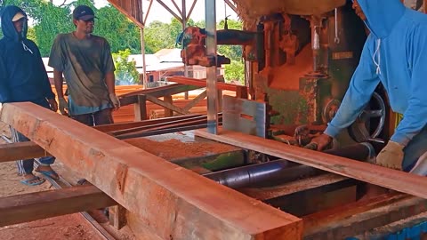 Band Saw. Meranti Red Stone Sawing Process Using A Band Saw