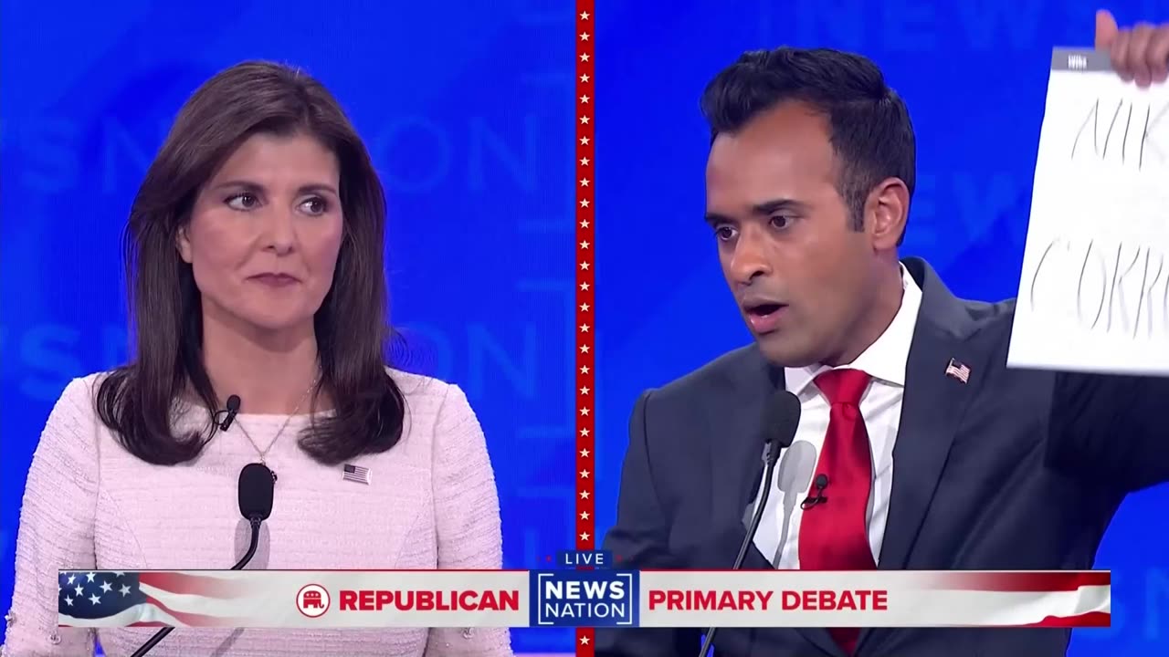 Holding up his debate notes