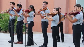 Mariachi students playing a Mexican song.