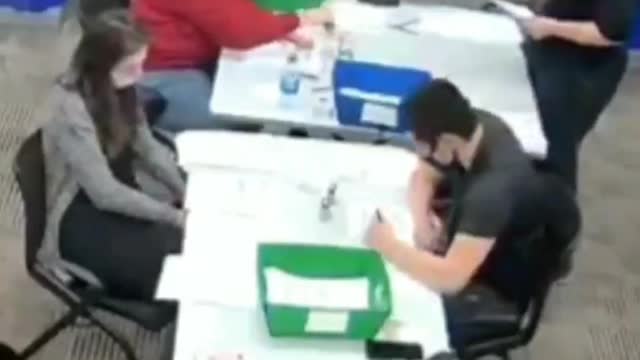 Poll Worker Filling Out Ballots