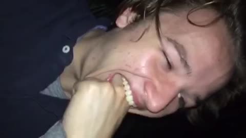 Guy in black shirt making himself throw up