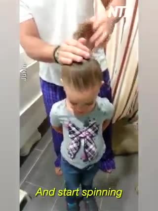 Dad Helps Daughter Create Hair Bun