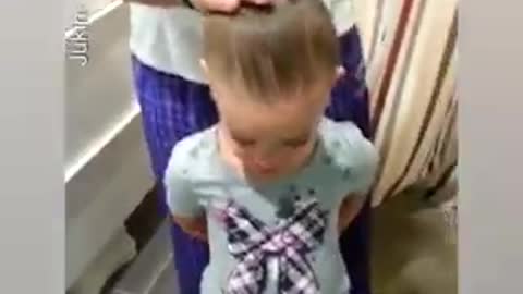 Dad Helps Daughter Create Hair Bun