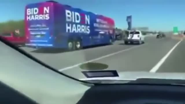 TSVN54 6.2021 FREEWAY FULL OF TRUMP SUPPORTERS CHASE BIDEN HARRIS BUS FLAGS FLYING