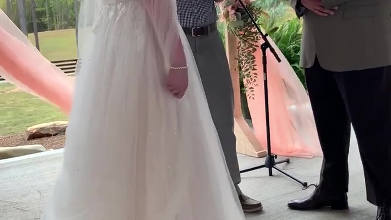 Wedding Ceremony Mishap Flower Arch Collapses on Couple During Their First Kiss