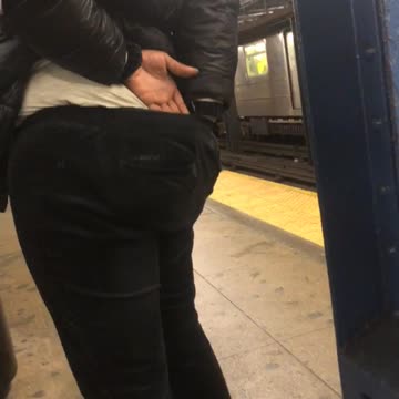 Woman pulls out wedgie and digs in pants at subway station
