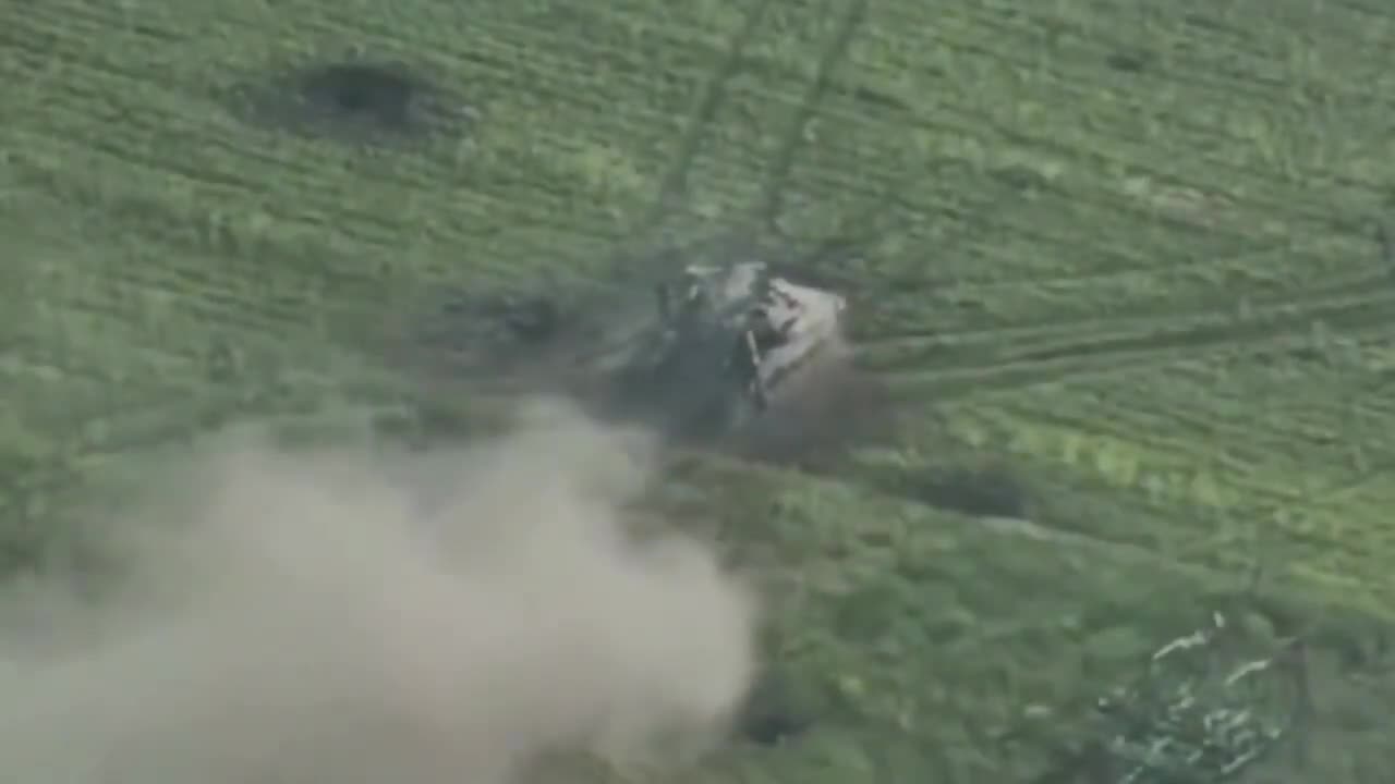 Russian soldiers running from destroyed tank