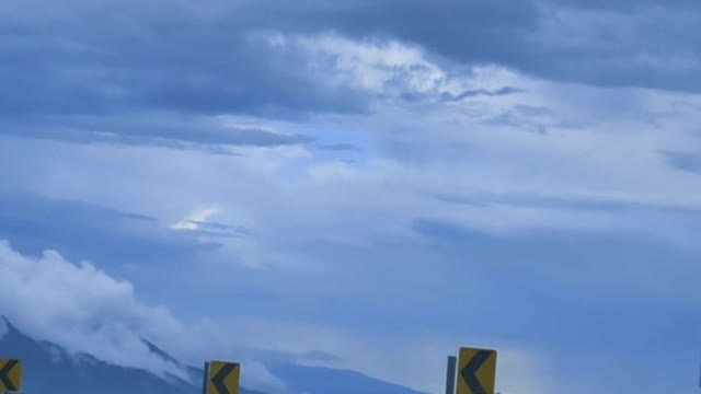 Going down a curved highway down a mountain