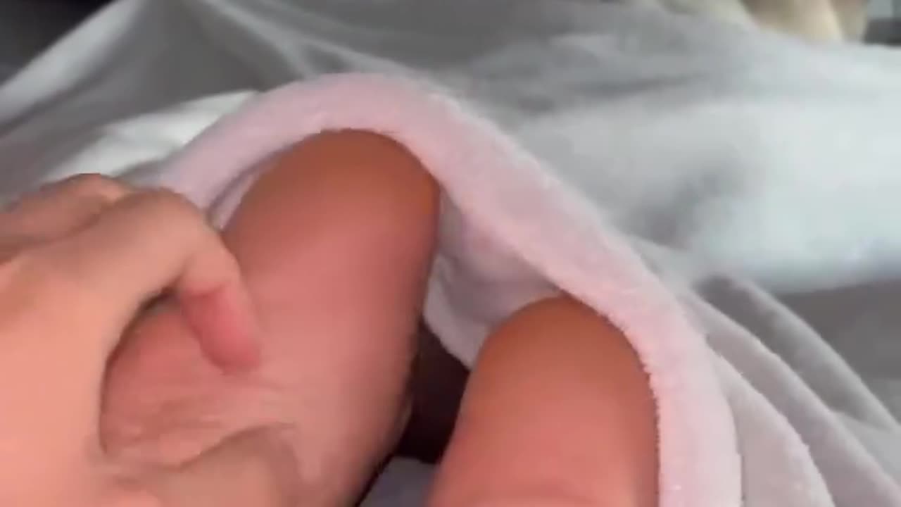 Tickling girlfriend feet in bed under covers