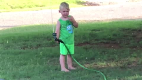 This little boy gets more of a drink than he bargained for!