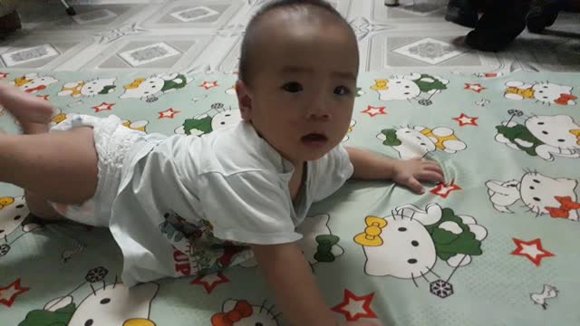 baby lying playing cute