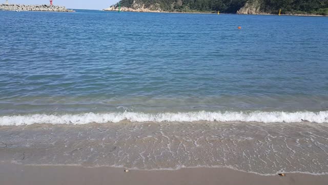 The sound of the waves on the beach