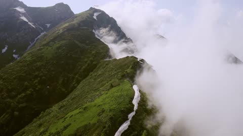 Drone Flying Over The Mountain Peak