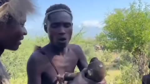 African man is eating monky