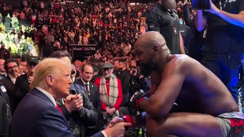 Jon Jones hands over the UFC heavyweight championship belt to the President Donald J. Trump...