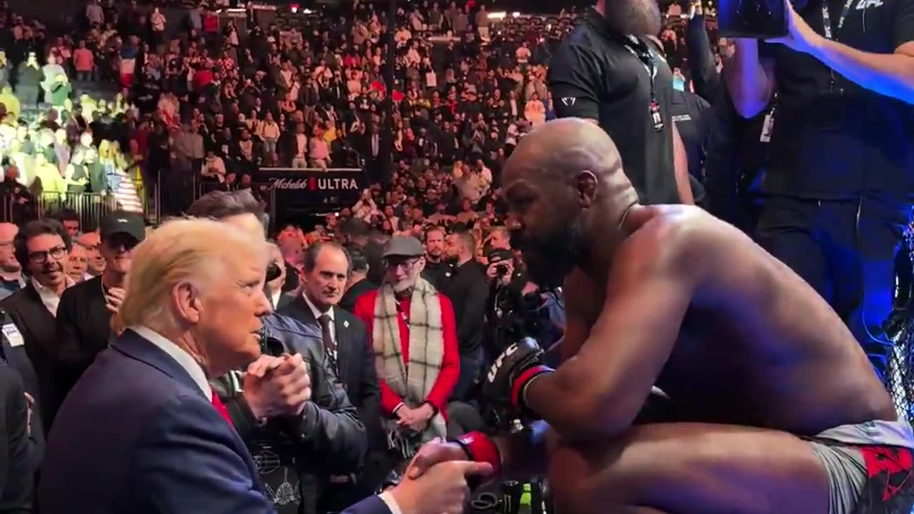 Jon Jones hands over the UFC heavyweight championship belt to the President Donald J. Trump...