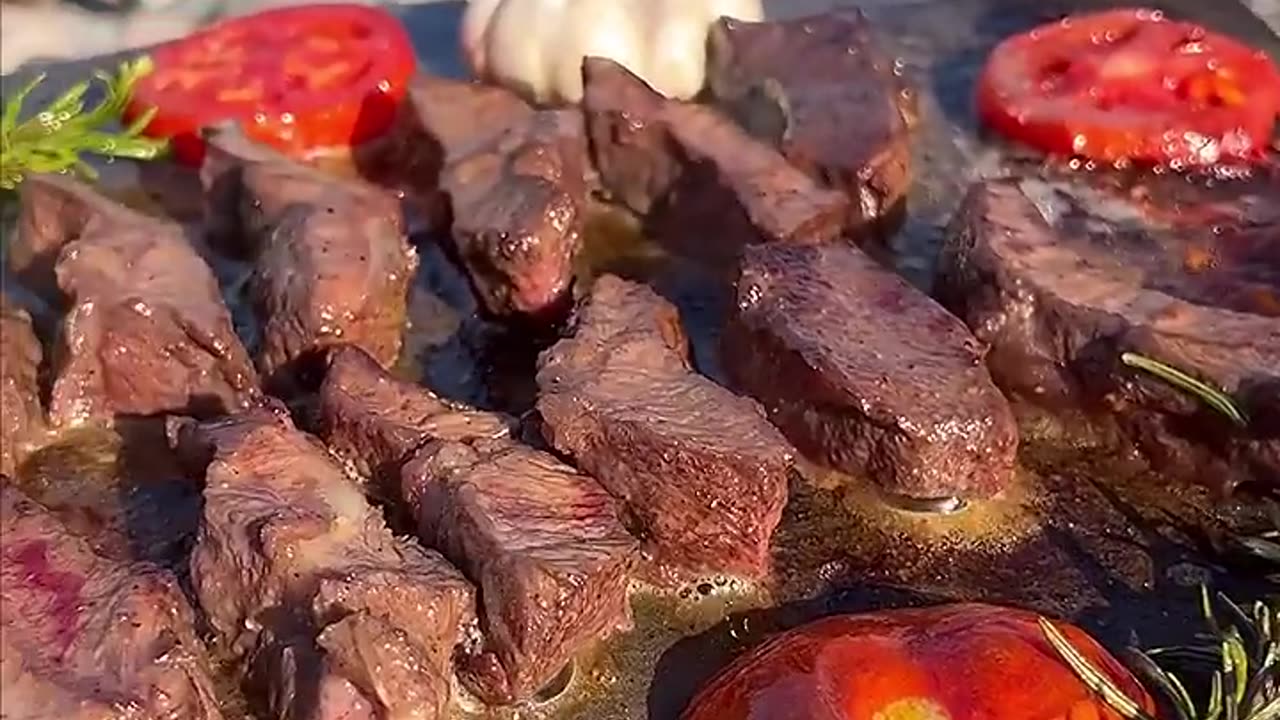 Very delicious grilled meat on the stone in nature