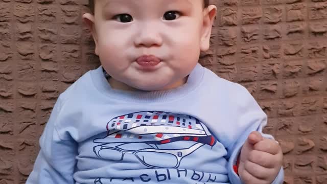 Baby eating orange funny