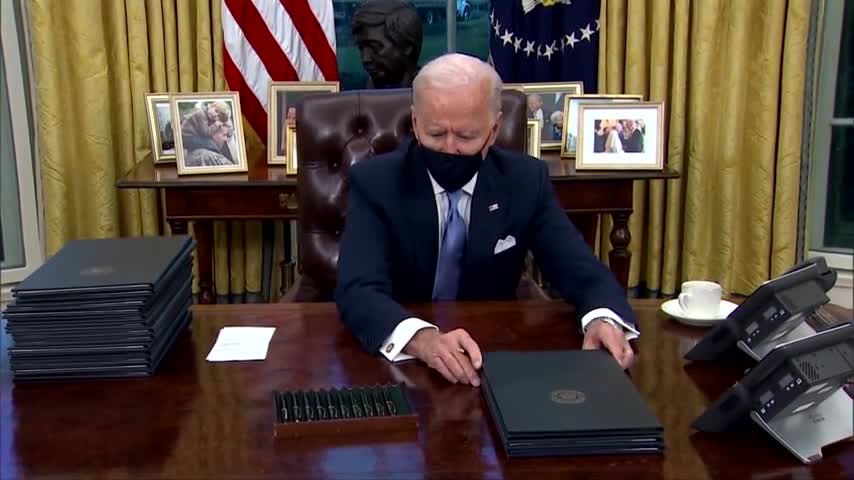 Barely on the job Biden signs executive actions today