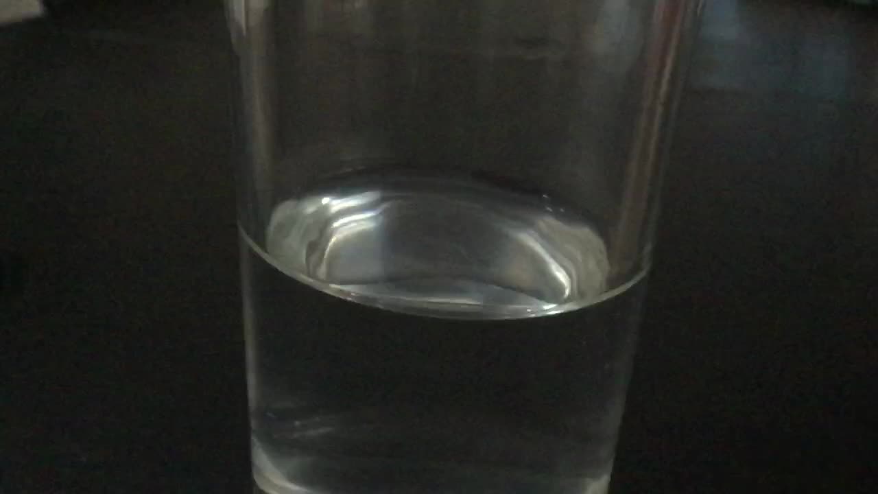 slow motion Water pouring into glass