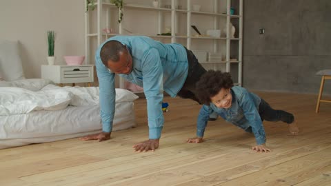 Father and son doing push-ups together