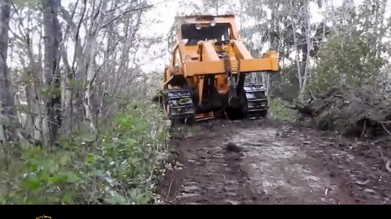 Bulldozers cut a road through the mountain