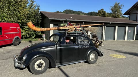 Volkswagen Beetle with an Alphorn on the roof