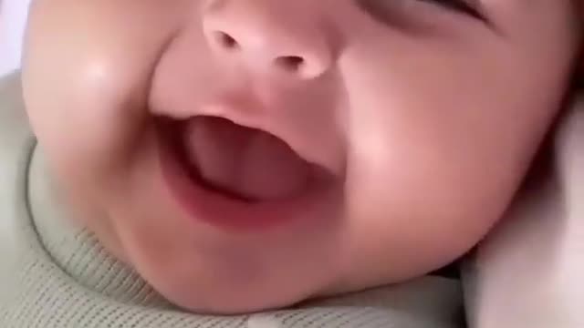 Baby want to sleep but keep smile